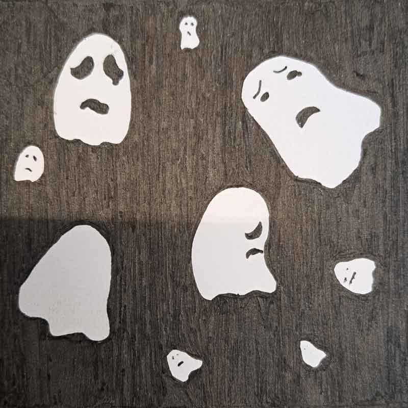 Cartoon ghosts on a black background